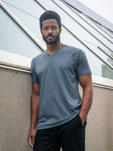 Jarrett is 6', 168lbs and wears a size M # Storm Blue V-Neck Lifestyle Size Medium | Fresh Clean Threads