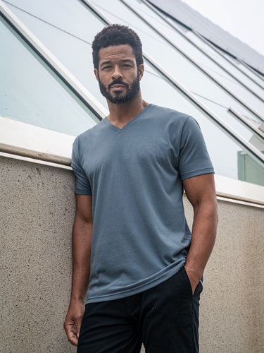 Jarrett is 6', 168lbs and wears a size M # Storm Blue V-Neck Lifestyle Size Medium | Fresh Clean Threads