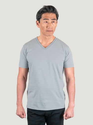 Phil is 6'1, 185lbs and wears a size M # Fog Grey V-Neck Studio Size Medium | Fresh Clean Threads