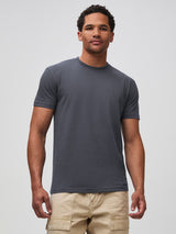 Mikah is 6'1" and wears a size medium in FCT # Nightfall deep navy crew neck t-shirt for men, StratuSoft™ fabric