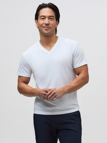 Kai is 5'8" and wears a size Medium Short  # White Layering Tees for Dress Shirts | white v-neck tees