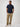Man wearing a navy shirt and khaki  pants |  stretch fabric, side pleats, forgiving fit, all-day comfort