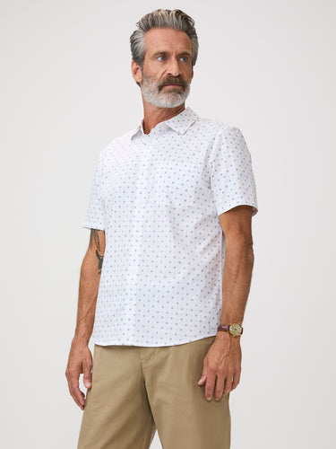 Man wearing a white patterned shirt | wear it open over a tee for a casual look that reads as put-together, or tuck it in