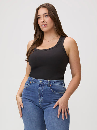 Tuck it. Layer it. Your call. # Women's ribbed tank top in black — fitted scoop neck, soft ribbed fabric, bra-friendly design