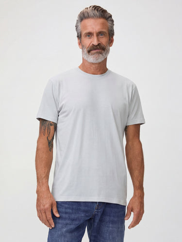 Michael is 6'1" and wears a size M  # Ash grey t-shirt styled with denim and sneakers, casual everyday outfit