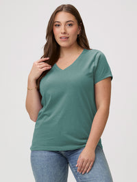 Laurel is 5'7" and wears a size M # Women's Model Wears a Medium in Sagebrush Green V-Neck | FCT