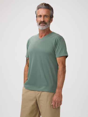 Michael is 6'1" and wears a size M # Men's Size Medium | Model in Pistachio V-Neck | Summer at FCT