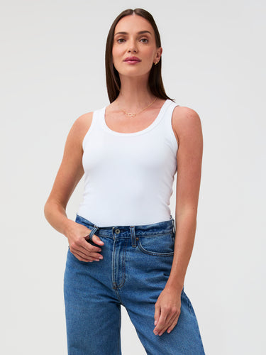 It hugs. But the good kind. # Women's White Ribbed Tank Top – Soft, Fitted & Bra-Friendly