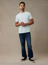 man wearing a pale mint green crew neck tee made with Light, breathable StratuSoft™ fabric