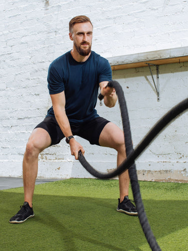 Nate is 6'4", 200LBS and wears a size LT # Navy Performance Crew Lifestyle Model Size LT