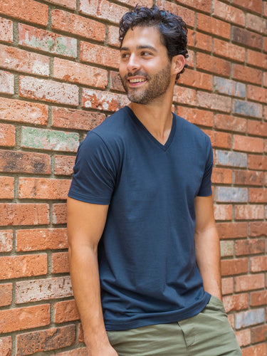 Colt is 6'2, 200lbs and wears a size M # Odyssey Blue V-Neck Lifestyle Size Medium | Fresh Clean Threads