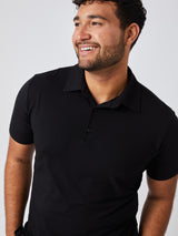 Matheus is 6', 210LBS and wears a size XL # All Black Performance Polo 3-pack Studio Front Angle Model Size XL | Fresh Clean Threads
