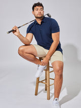 Matheus is 6', 210LBS and wears a size XL # Navy Performance Polo Studio Model Size XL | Fresh Clean Threads