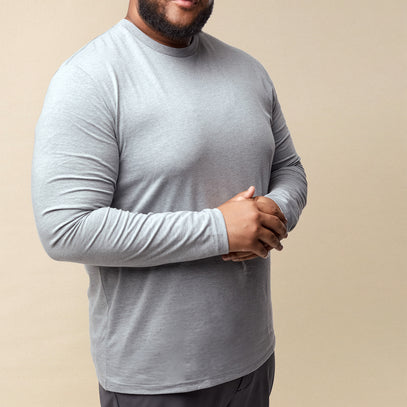 Man wearing a heather gray long sleeve shirt | Fresh Clean Threads