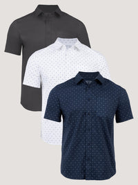 Three short-sleeve shirts in vintage black, white with blue pattern, and navy with pattern 