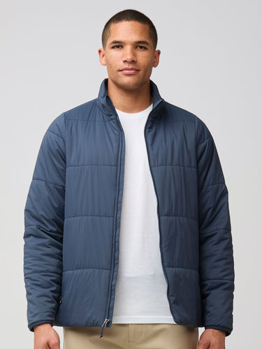 Mikah is 6'1" and wears a size medium # Odyssey Blue Puffer Jacket Medium | Fresh Clean Threads