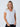 Maddy is 5'8", size 4 and wears a size S # Womens White V-Neck Top | Model Small | Made with StratuSoft