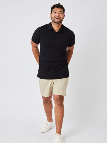 Matheus is 6', 210LBS and wears a size XL # Men's Black Performance Polo | Designed to move, made to fit just right