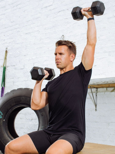 Brad is 5'9", 170LBS and wears a size M # Brad is size Medium | Black Performance Crew Neck Tee Shirts in Action | At the gym in a Fresh Clean Threads Tee 
