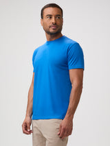 Man wearing crew t-shirt in arctic blue available in up to 18 mens sizes