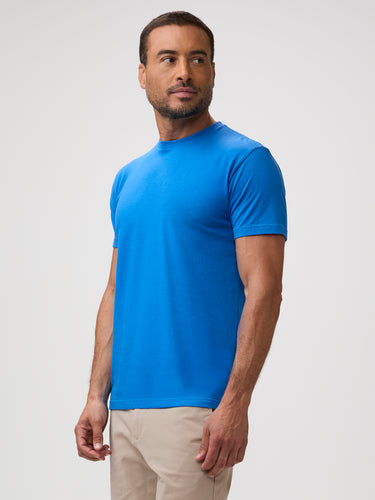 Man wearing crew t-shirt in arctic blue available in up to 18 mens sizes
