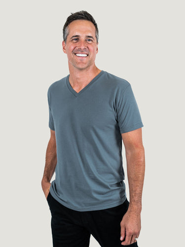 Ben is 6'1, 180lbs and wears a size M # Storm Blue V-Neck Studio Size Medium | Fresh Clean Threads