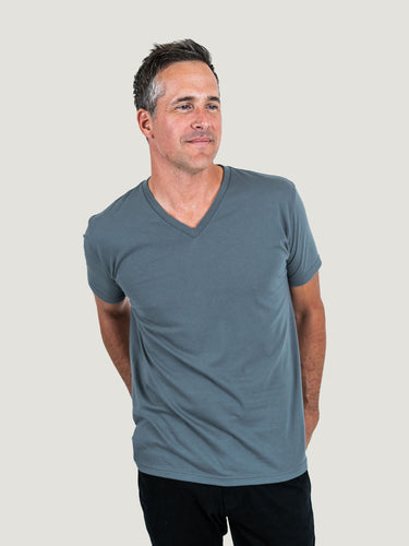 Ben is 6'1, 180lbs and wears a size M # Storm Blue V-Neck Studio Size Medium | Fresh Clean Threads